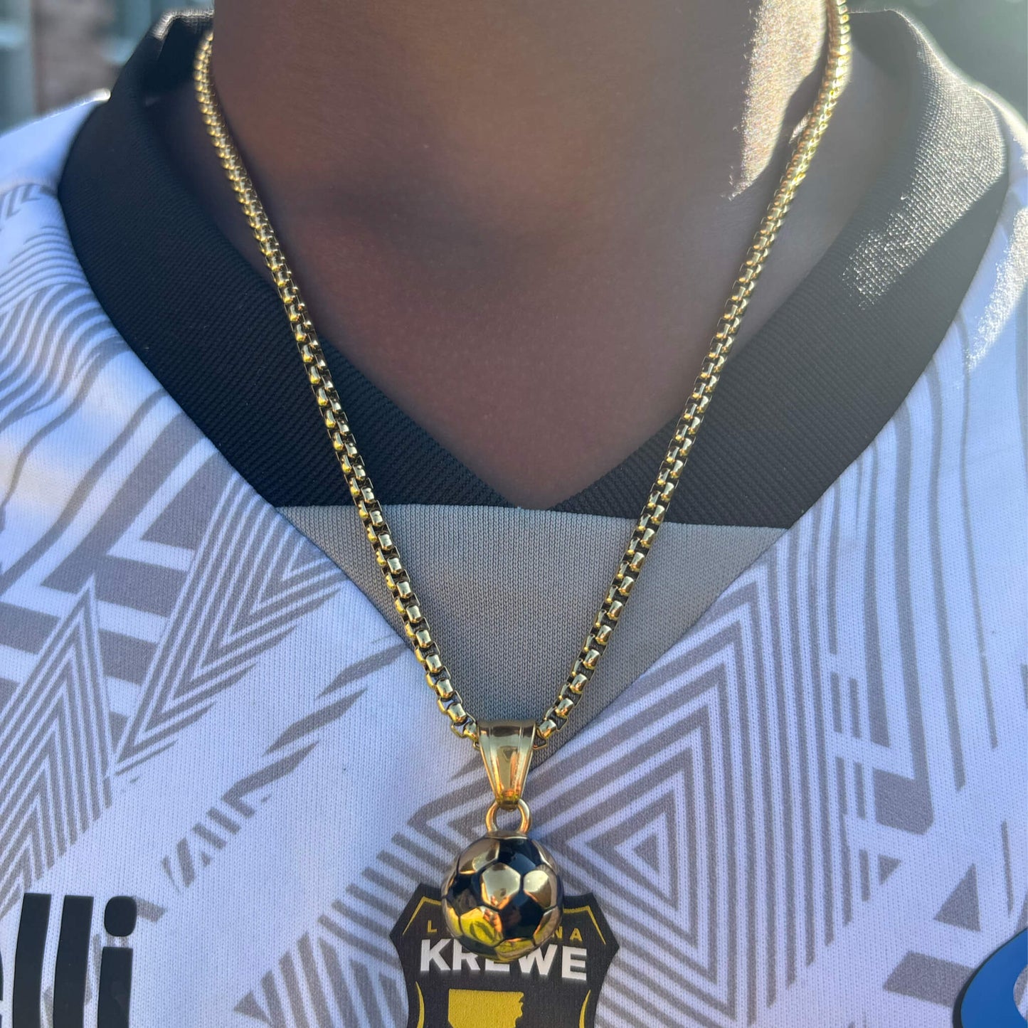 3D soccer pendant necklace in gold plated stainless steel worn on gold box chain