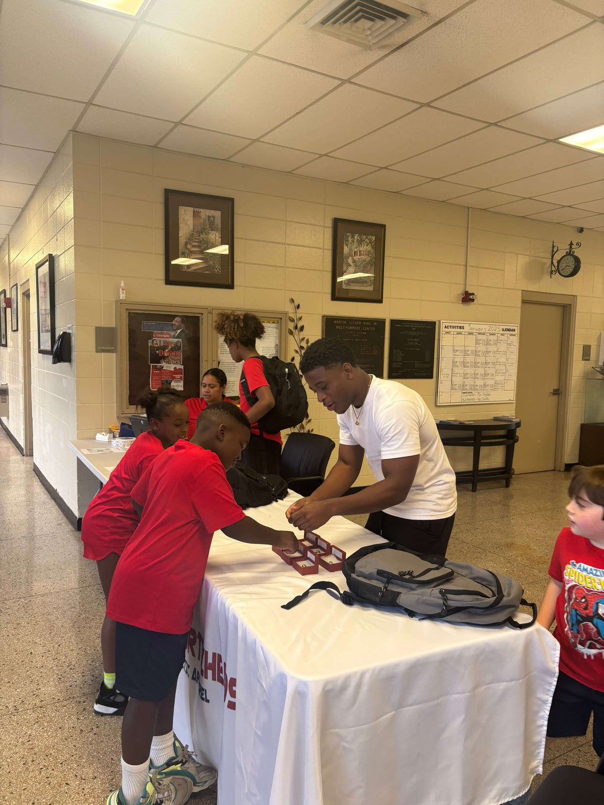 Jadon Johnson owner of Sportzzheads with his basketball team