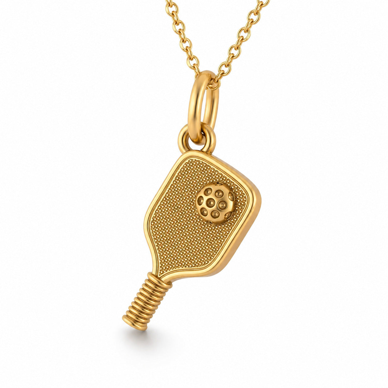 A gold pendant necklace featuring a pickleball paddle-shaped charm, suspended from a delicate gold chain against a clean white background.