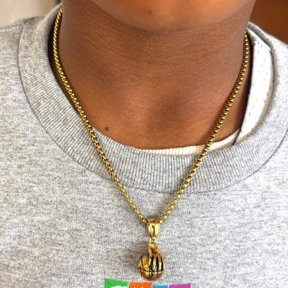 Hand Palming Basketball Pendant on 14k gold plated chain necklace worn on neck