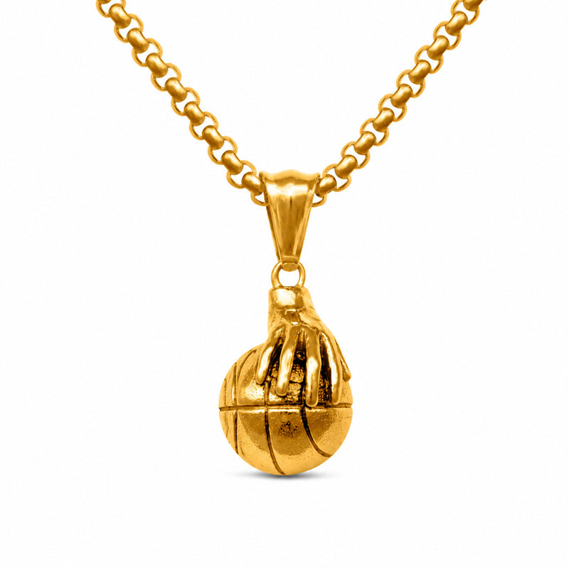 A gold pendant necklace featuring a basketball-shaped charm hanging from a gold chain, shown against a plain white background.