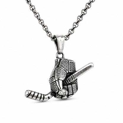 A silver-toned metal pendant necklace featuring a hockey glove holding a stick, suspended from a matching chain against a plain white background.