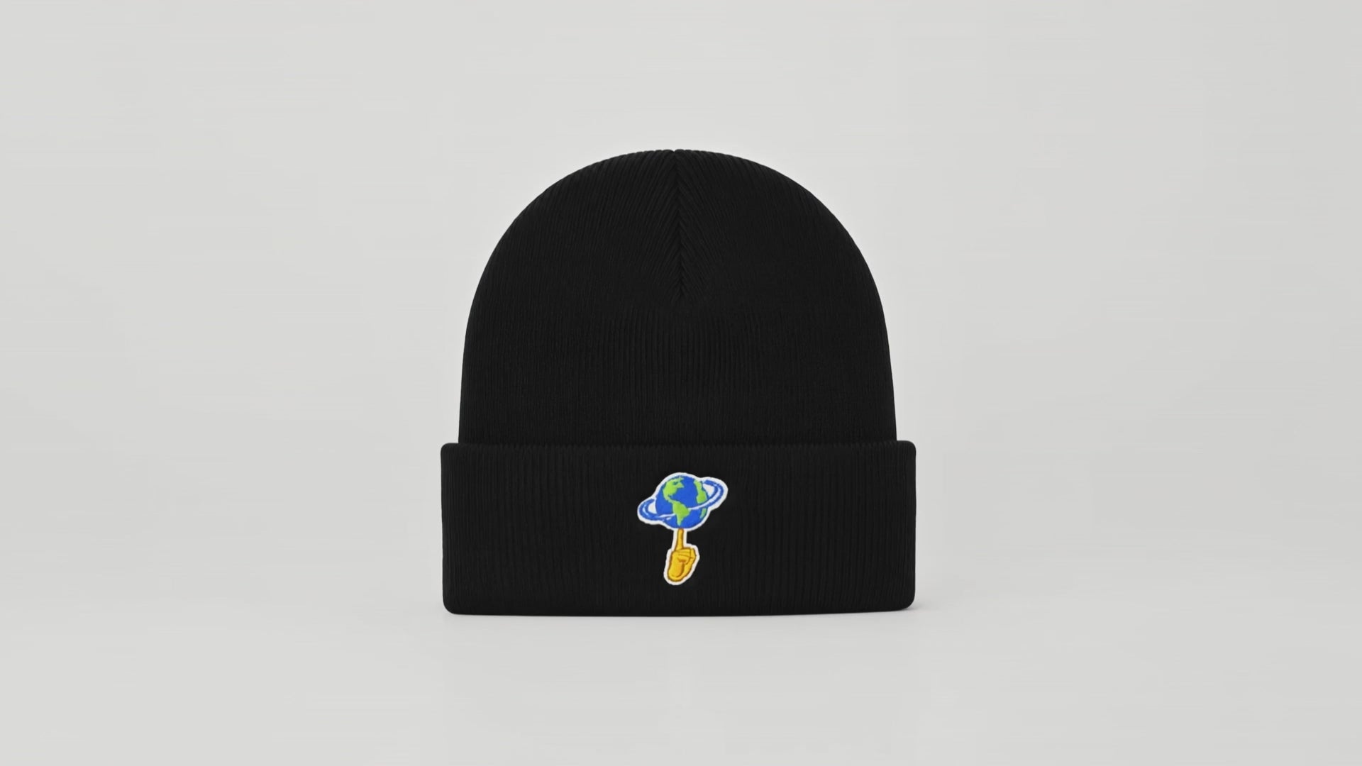 Black beanie with 'World is Yours' text on a white background
